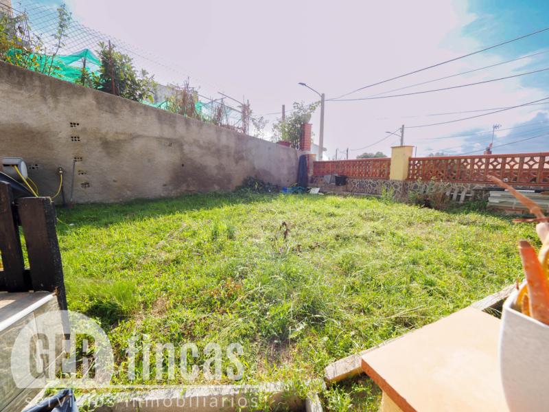 Casa de cuatro vientos con jardín y planta superior diáfana · Jardín